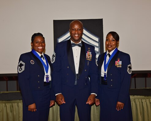 U.S. Air Force Senior Master Sgts. Melissa D. Bridges (left) and Joi T. Washington (right) pose for a photo with Chief Master Sgt. Antonio Cooper, 14th Flying Training Wing command chief at the Chief Induction ceremony, July 22, 2021 on Columbus Air Force Base, Miss. Chief Master Sergeants are able to serve as Squadron Superintendents, Group Superintendents, First Sergeants and Command Chief Master Sergeants, each with its own unique duty responsibilities. (Multimedia Services photo by Melissa A. Duncan-Doublin)