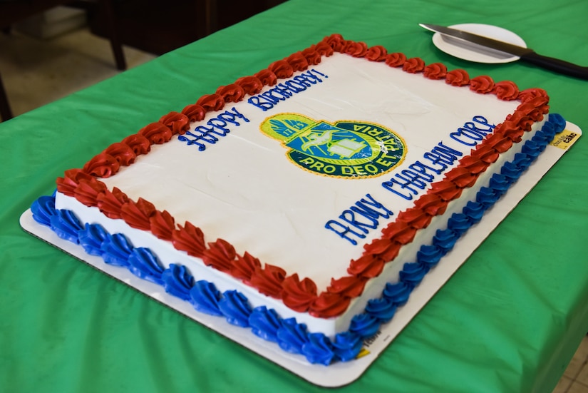 U.S. Army and U.S. Air Force Chaplains, Religious Support Teams and their families gather for a traditional cake cutting at Joint Base McGuire-Dix-Lakehurst, N.J., July 29, 2021. The cake cutting ceremony is a tradition used to commemorate the Army Chaplain Corps. It followed a ceremony held in the Soldier’s Chapel.