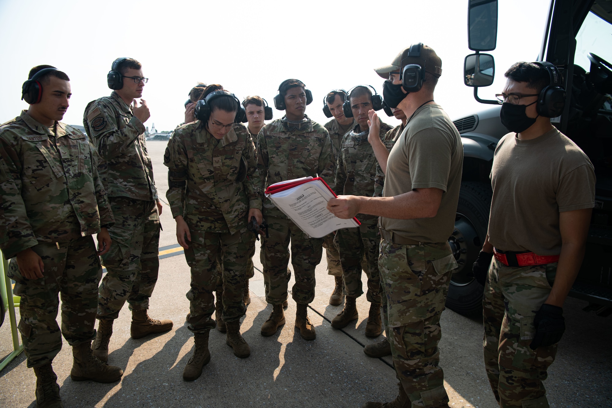 Tech. Sgt. Christopher Stollings, 436th Logistics Readiness Squadron fuels distribution noncommissioned officer in charge, briefs Airmen from the 436th LRS petroleum, oil and lubricant flight on wet wing defueling procedures on Dover Air Force Base, Delaware, July 30, 2021. Airmen from the 436th LRS POL flight and the 3rd AS performed the first C-17 Globemaster III wet wing defuel procedure at Dover AFB. (U.S. Air Force photo by Senior Airman Marco A. Gomez)