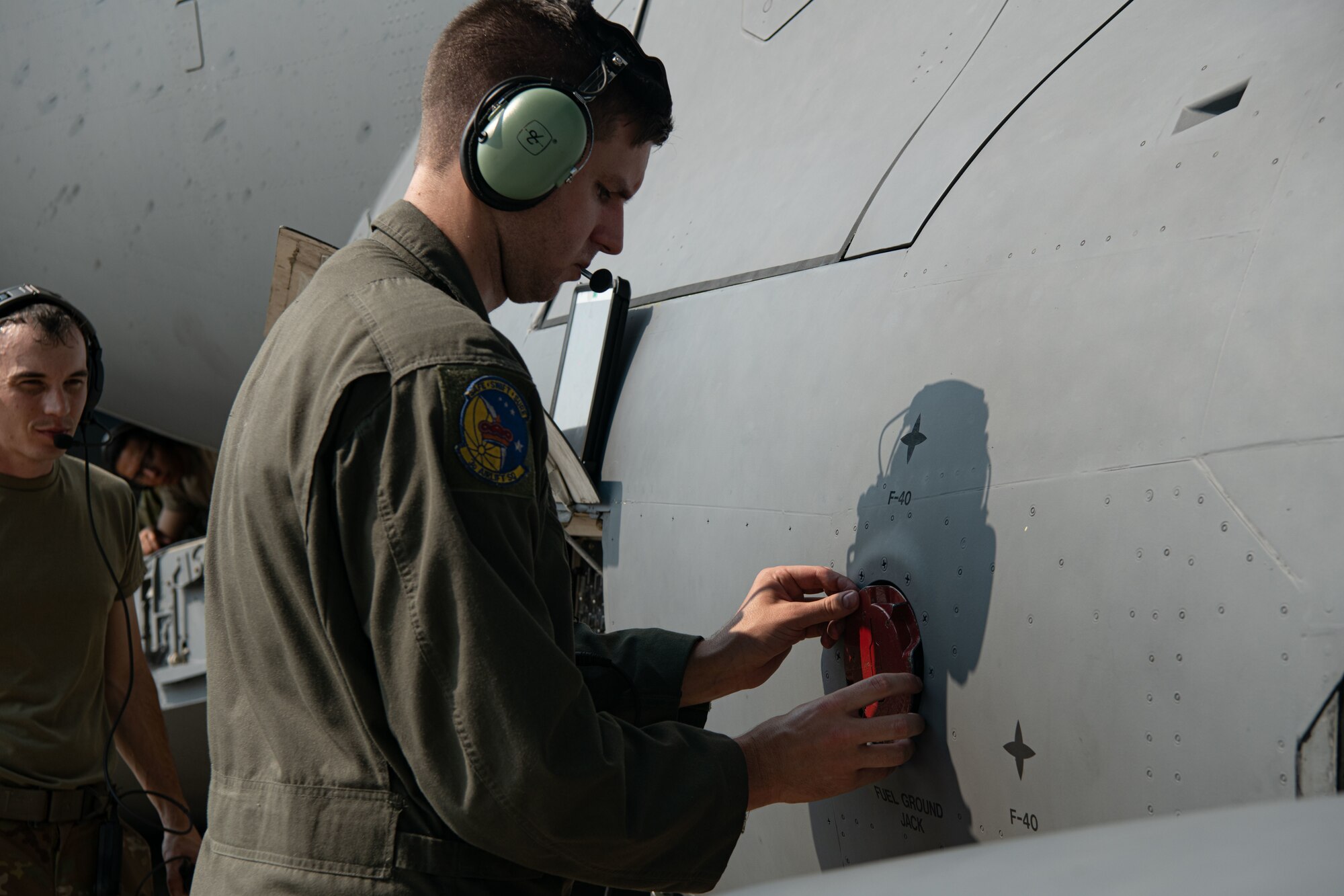 Staff Sgt. Morgen Sindelar, 3rd Airlift Squadron loadmaster, secures a fuel cap onto a C-17 Globemaster III on Dover Air Force Base, Delaware, July 30, 2021