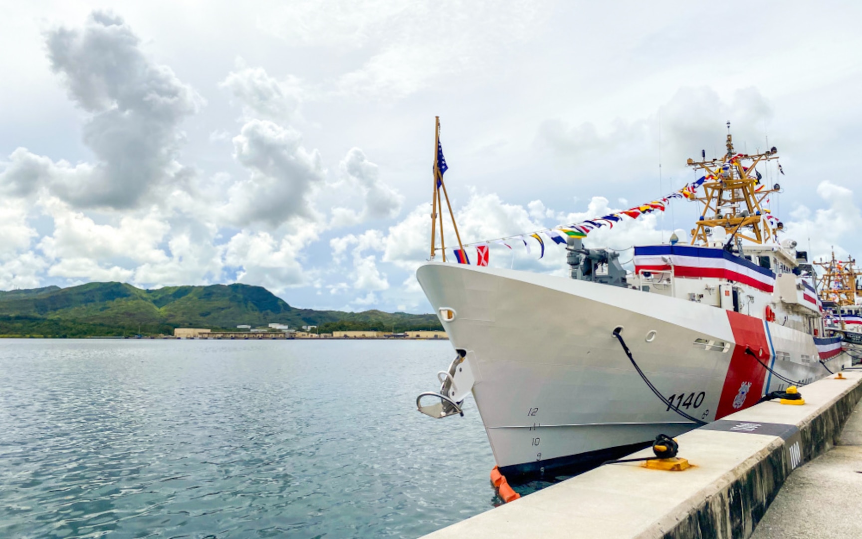 Adm. Karl Schultz, the commandant of the Coast Guard, presides over a rare triple-commissioning ceremony at Coast Guard Sector Guam July 29, 2021. During the ceremony, Coast Guard Cutters Myrtle Hazard, Oliver Henry and Fredrick Hatch were commissioned. (U.S. Coast Guard photo by Petty Officer 1st Class Travis Magee/Released)