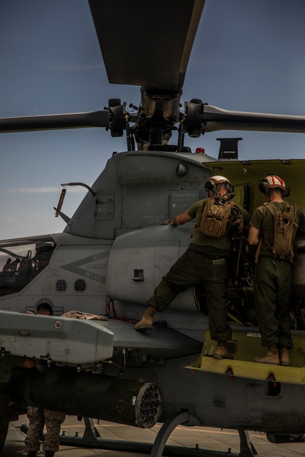 Marines with Marine Heavy Helicopter Squadron (HMH) 772 perform maintenance on a CH-53E Super Stallion helicopter during Integrated Training Exercise (ITX) 4-21 at Marine Corps Air Ground Combat Center, Twentynine Palms, California on July 28, 2021. HMH-772 is supporting Marine Air Ground Task Force 25 as part of the Aviation Combat Element during ITX, providing troop transport and heavy lift capabilities. (U.S. Marine Corps photo by Lance Cpl. Samwel Tabancay)