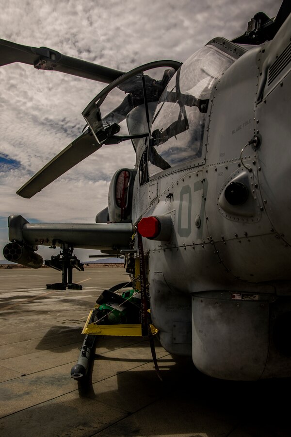 Marines with Marine Heavy Helicopter Squadron (HMH) 772 perform maintenance on a CH-53E Super Stallion helicopter during Integrated Training Exercise (ITX) 4-21 at Marine Corps Air Ground Combat Center, Twentynine Palms, California on July 28, 2021. HMH-772 is supporting Marine Air Ground Task Force 25 as part of the Aviation Combat Element during ITX, providing troop transport and heavy lift capabilities. (U.S. Marine Corps photo by Lance Cpl. Samwel Tabancay)