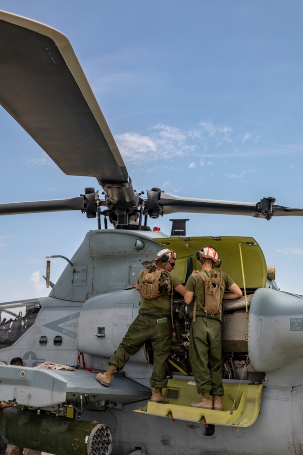 Marines with Marine Heavy Helicopter Squadron (HMH) 772 perform maintenance on a CH-53E Super Stallion helicopter during Integrated Training Exercise (ITX) 4-21 at Marine Corps Air Ground Combat Center, Twentynine Palms, California on July 28, 2021. HMH-772 is supporting Marine Air Ground Task Force 25 as part of the Aviation Combat Element during ITX, providing troop transport and heavy lift capabilities. (U.S. Marine Corps by photo Sgt. JVonnta Taylor)