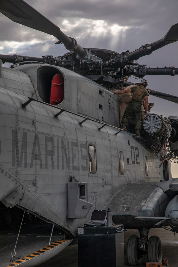 Marines with Marine Heavy Helicopter Squadron (HMH) 772 perform maintenance on a CH-53E Super Stallion helicopter during Integrated Training Exercise (ITX) 4-21 at Marine Corps Air Ground Combat Center, Twentynine Palms, California on July 28, 2021. HMH-772 is supporting Marine Air Ground Task Force 25 as part of the Aviation Combat Element during ITX, providing troop transport and heavy lift capabilities. (U.S. Marine Corps photo by Sgt. JVonnta Taylor)