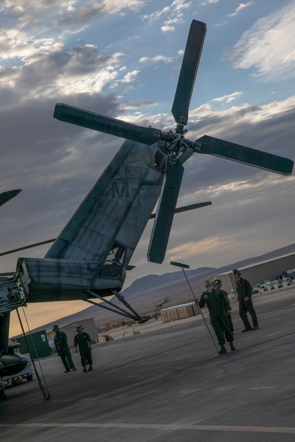 Marines with Marine Heavy Helicopter Squadron (HMH) 772 perform maintenance on a CH-53E Super Stallion helicopter during Integrated Training Exercise (ITX) 4-21 at Marine Corps Air Ground Combat Center, Twentynine Palms, California on July 28, 2021. HMH-772 is supporting Marine Air Ground Task Force 25 as part of the Aviation Combat Element during ITX, providing troop transport and heavy lift capabilities. (U.S. Marine Corps photo by Sgt. JVonnta Taylor)