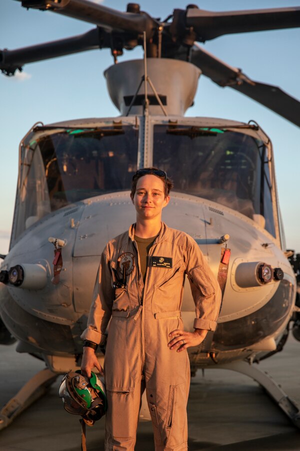 Sgt. Molly Brennan, an airframes mechanic with Marine Light Attack Helicopter Squadron 773 poses in front of an UH-1Y helicopter during Integrated Training Exercise (ITX) 4-21 at Marine Corps Air Ground Combat Center, Twentynine Palms, California on July 28, 2021. HMLA-773 is supporting Marine Air Ground Task Force 25 as part of the Aviation Combat Element during ITX, providing close air support and deep air support to the Ground Combat Element. (U.S. Marine Corps by photo Sgt. JVonnta Taylor)