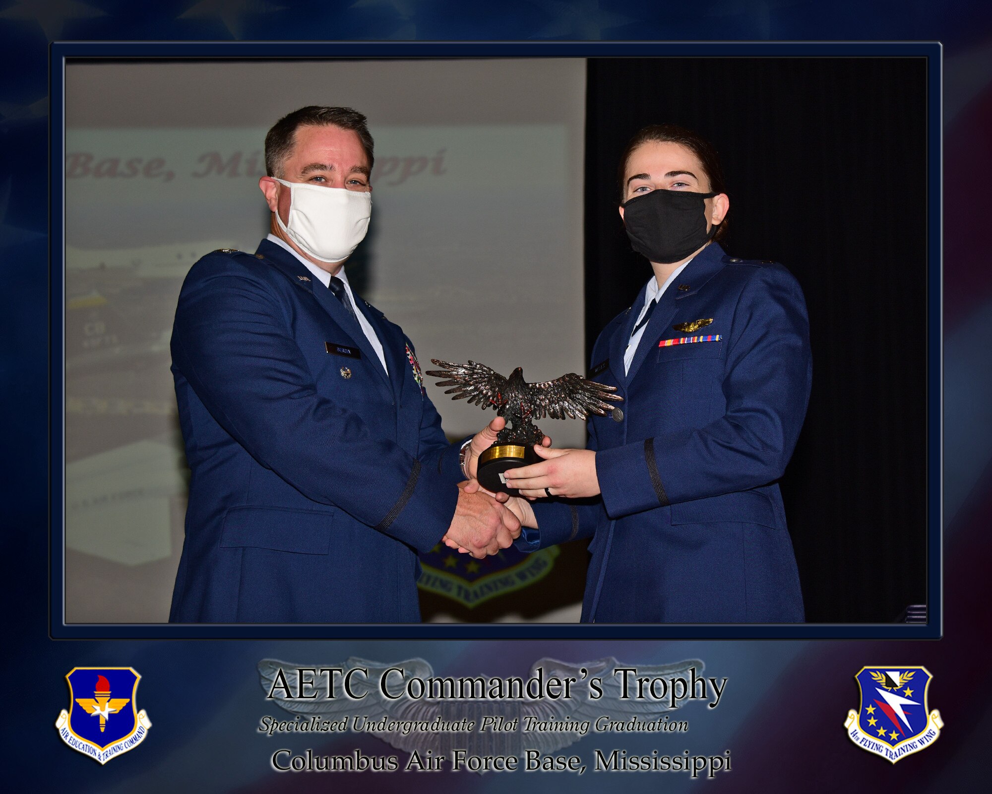 U.S. Air Force 1st Lt. Raina Cerniglia, 14th Flying Training Wing SUPT graduate, receives one of three Order of Daedalians AETC Commanders Trophy’s, July 30, 2021, on Columbus Air Force Base, Miss. The Order of Daedalians is America’s premier fraternal organization of military aviators and is presented to the class’s most outstanding graduates.  (U.S. Air Force photo by Melissa Duncan-Doublin)