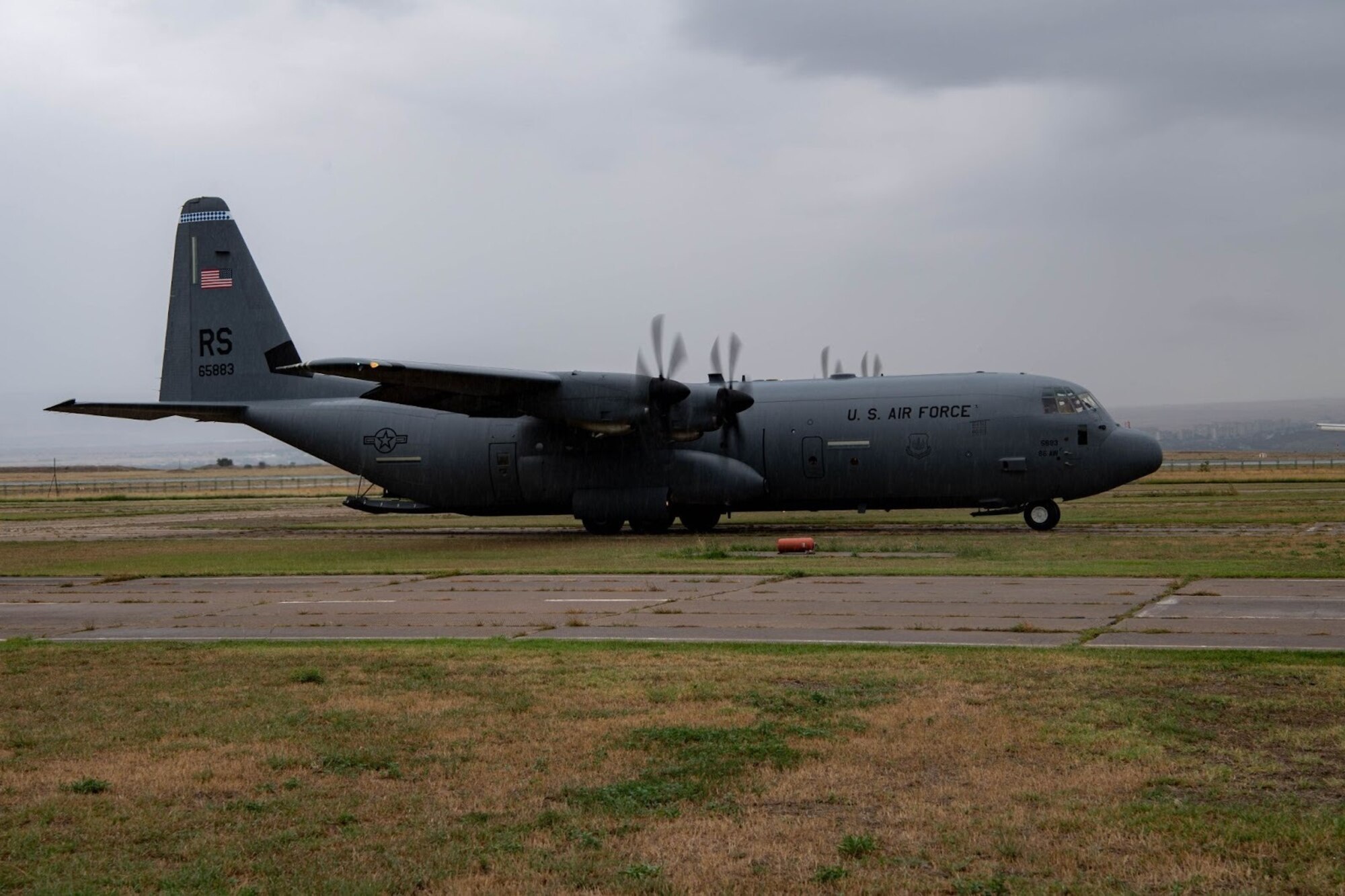 A U.S. Air Force C-130J Super Hercules aircraft sits on an airfield during exercise Agile Spirit 21