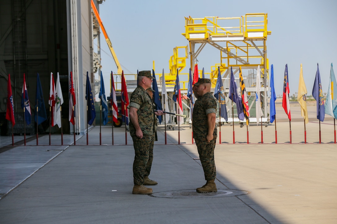 U.S. Marine Corps Sgt. Maj. Frank Gratacos salutes Col. Bryon Sullivan during a change of command ceremony on Marine Corps Air Station Yuma, Ariz., June 15, 2021.