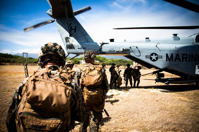 U.S. Marines from 1st Battalion, 3d Marines, load up into a CH-53 Super Stallion attached to Marine Heavy Helicopter Squadron 463 during an insertion and extraction training event, Marine Corps Base Hawaii, July 22, 2021. As a host platform to all elements of the Marine Air Ground Task Force, Marine Corps Base Hawaii provides the necessary environment to produce readiness in the air, on land and at sea. (U.S. Marine Corps photo by Lance Cpl. Brandon Aultman)