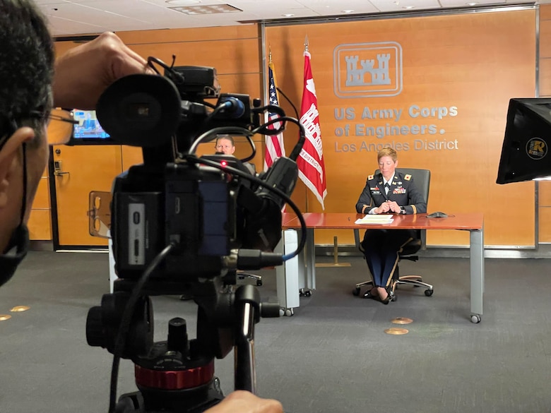 Richard Rivera, visual information specialist with the Los Angeles District, records Col. Julie Balten, LA District commander, and David Van Dorpe, district deputy engineer, as they host the 246th Engineer Day virtual observance from the district headquarters July 29, 2021.