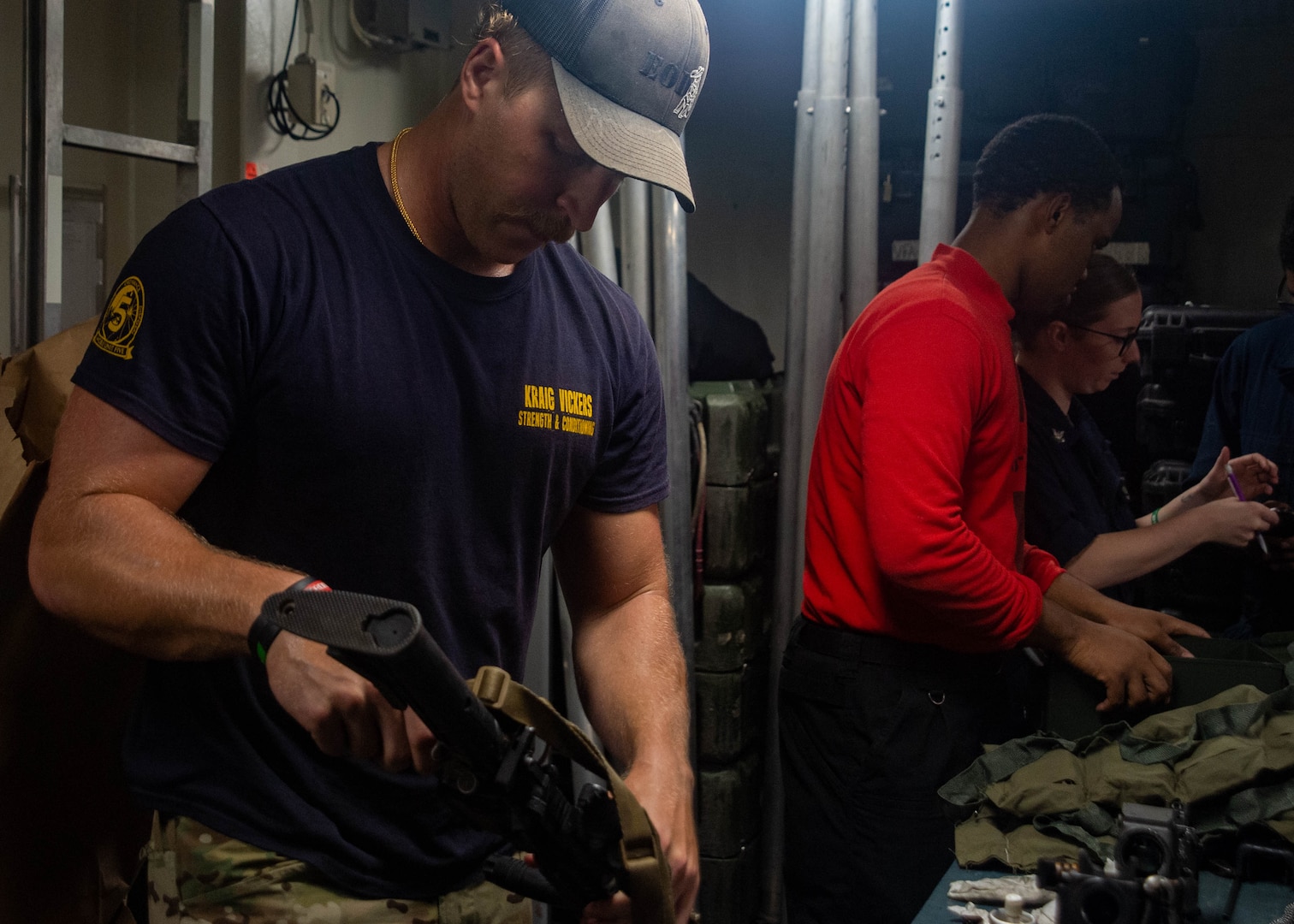 210730-N-YQ181-1113 ARABIAN SEA (July 30, 2021) – An Explosive Ordnance Disposal Technician, assigned to Explosive Ordnance Disposal Mobile Unit (EODMU) 5, prepares equipment in response to a call for assistance from a vessel in distress in the Arabian Sea, July 30. EODMU5 is attached to Commander, Task Force 50, deployed to the U.S. 5th Fleet area of operations in support of naval operations to ensure maritime stability and security in the Central Region, connecting the Mediterranean and Pacific through the western Indian Ocean and three strategic choke points. (U.S. Navy photo by Mass Communication Specialist 3rd Class Askia Collins)