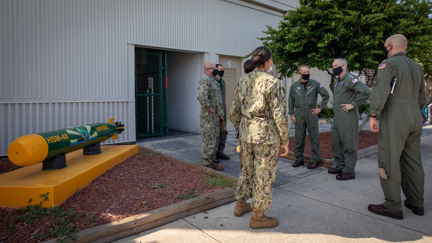 Vice Chief of Naval Operations Adm. Bill Lescher, second from right, speaks with the command leadership of the "Vipers" of Helicopter Maritime Strike Squadron (HSM) 40 at Naval Station Mayport, Florida.