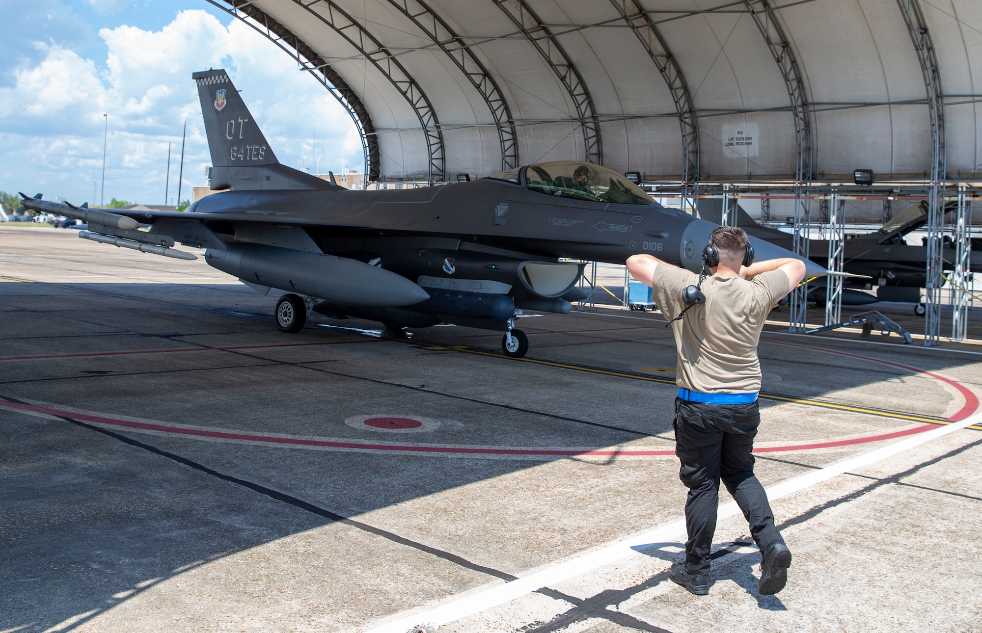 Lt. Col Zachary 'Rooster' Probst taxis  a F-16C Fighting Falcon from the 84th Test and Evaluation Squadron before a test near Eglin Air Force Base, Fla., June 14, 2021.   (U.S. Air Force photo by Tech. Sgt. John Raven)