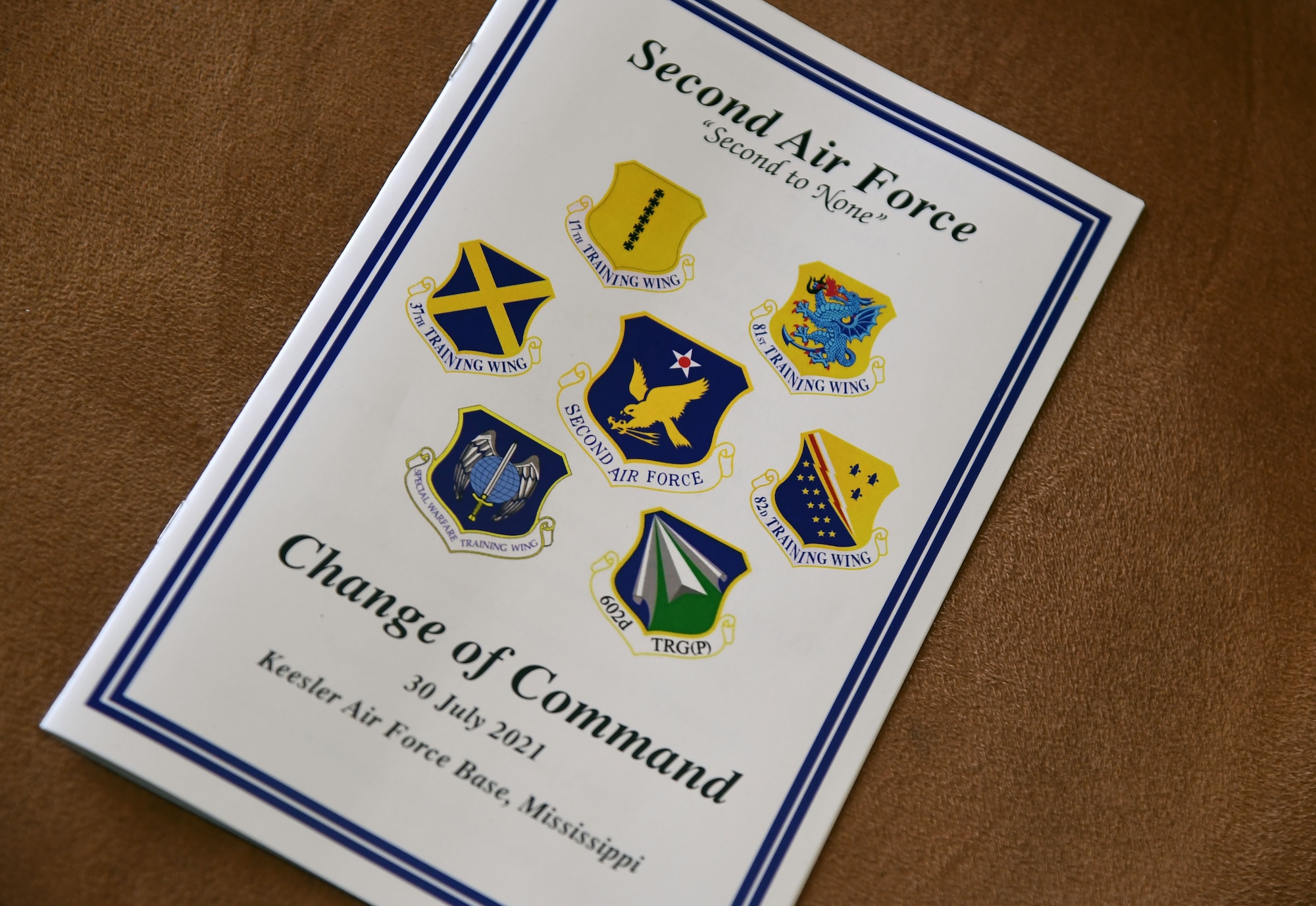 A pamphlet is on display during the Second Air Force change of command ceremony inside the Bay Breeze Event Center at Keesler Air Force Base, Mississippi, July 30, 2021. The ceremony is a symbol of command being exchanged from one commander to the next. Maj. Gen. Andrea Tullos relinquished command of the Second Air Force to Maj. Gen. Michele Edmondson. (U.S. Air Force photo by Kemberly Groue)