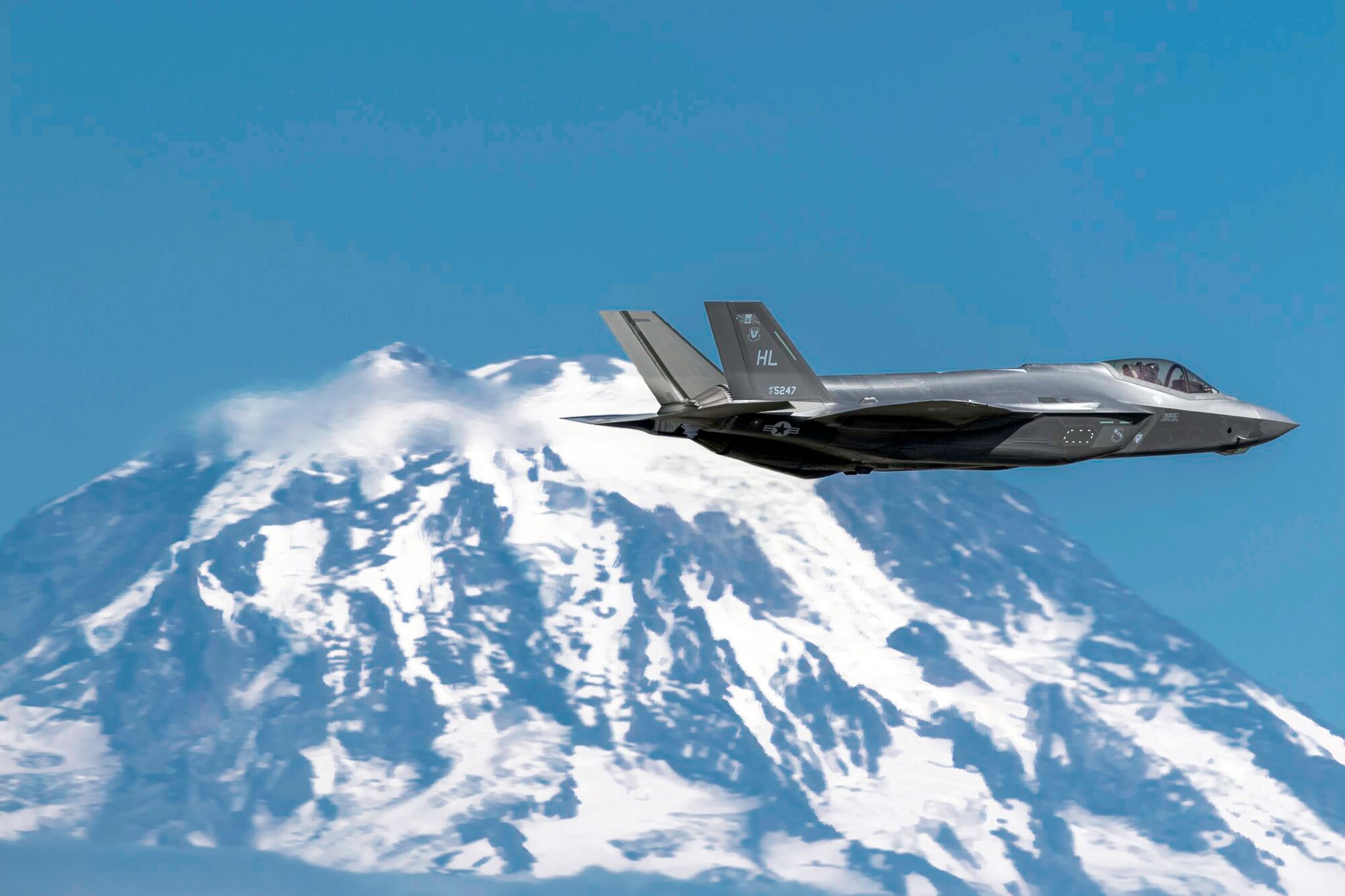 F-35A Lighting II Flying with Tacoma Mountains on Flank