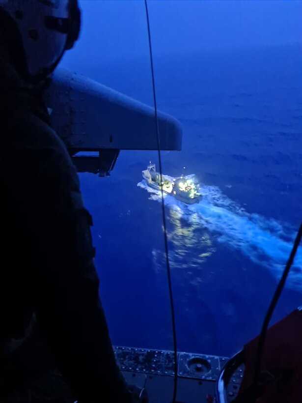 Members from U.S. Navy Helicopter Sea Combat Squadron Two-Five arrive on scene to an Army Watercraft System, where a U.S. Army Soldier sustained injures and needed a medical evacuation in the Pacific Ocean, off the coast of Angaur, Palau, July 25, 2021. After the Solider was injured while at sea during Exercise Forager 21, members from U.S. Air Force, U.S. Navy, U.S. Coast Guard worked together to provide lifesaving assistance to the Soldier.