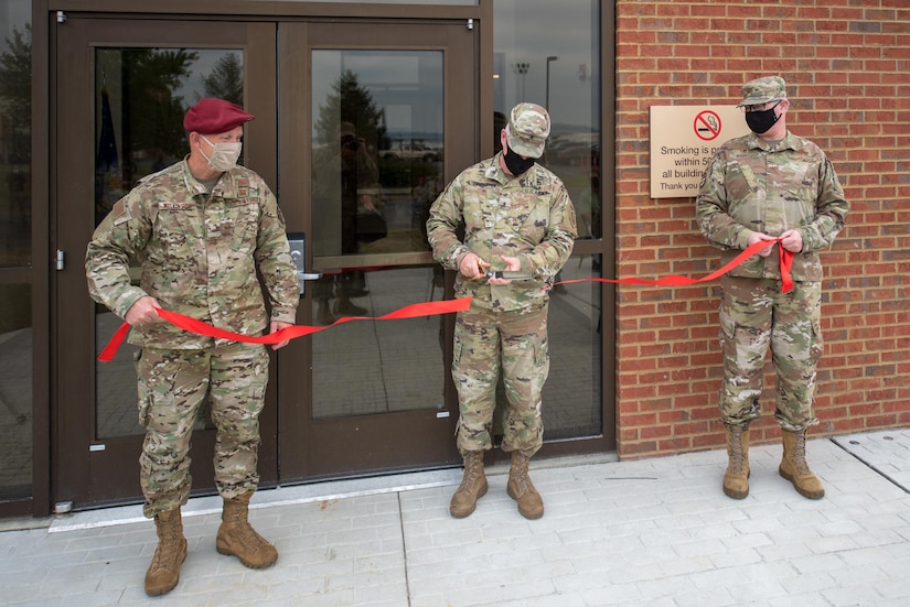 Brig. Gen. Hal Lamberton (center), adjutant general for the Commonwealth of Kentucky, cuts a ribbon held by Col. David Mounkes (right), commander of the 123rd Airlift Wing, and Brig. Gen. Jeffrey Wilkinson, assistant adjutant general for Air, Kentucky Air National Guard, during the dedication of a new Response Forces Facility at the Kentucky Air National Guard Base in Louisville, Ky., July 30, 2021. The 28,000-square-foot building will house the 123rd Security Forces Squadron, the 123rd Contingency Response Group, a Fatality Search and Recovery Team, and a medical detachment for the state’s Chemical, Biological, Radiological, Nuclear and high-yield Explosive Enhanced Response Force Package. (U.S. Air National Guard photo by Phil Speck)