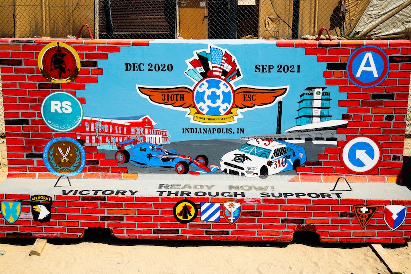 The completed T-wall for the 310th Sustainment Command (Expeditionary) at Camp Arifjan, Kuwait.  Chief Warrant Officer 2 Paul Viall worked countless hours in extreme heat to paint a mural that will represent the hard work and dedication of the Army Reserve’s Indianapolis-based “Brickyard” Soldiers and their time serving within the U.S. Central Command’s area of responsibility.