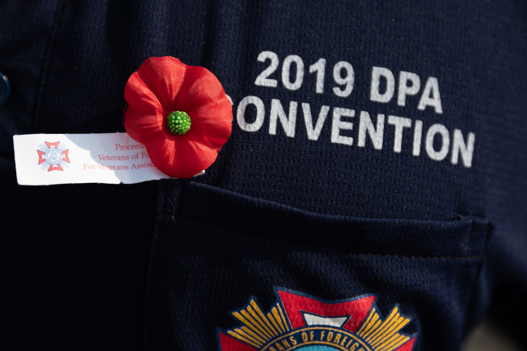 A red poppy worn during a Memorial Day remembrance event at Osan Air Base, Republic of Korea, May 28, 2021. Red poppies are a symbol of both remembrance and hope for a peaceful future. (U.S. Air Force photo by Senior Airman Branden Rae)