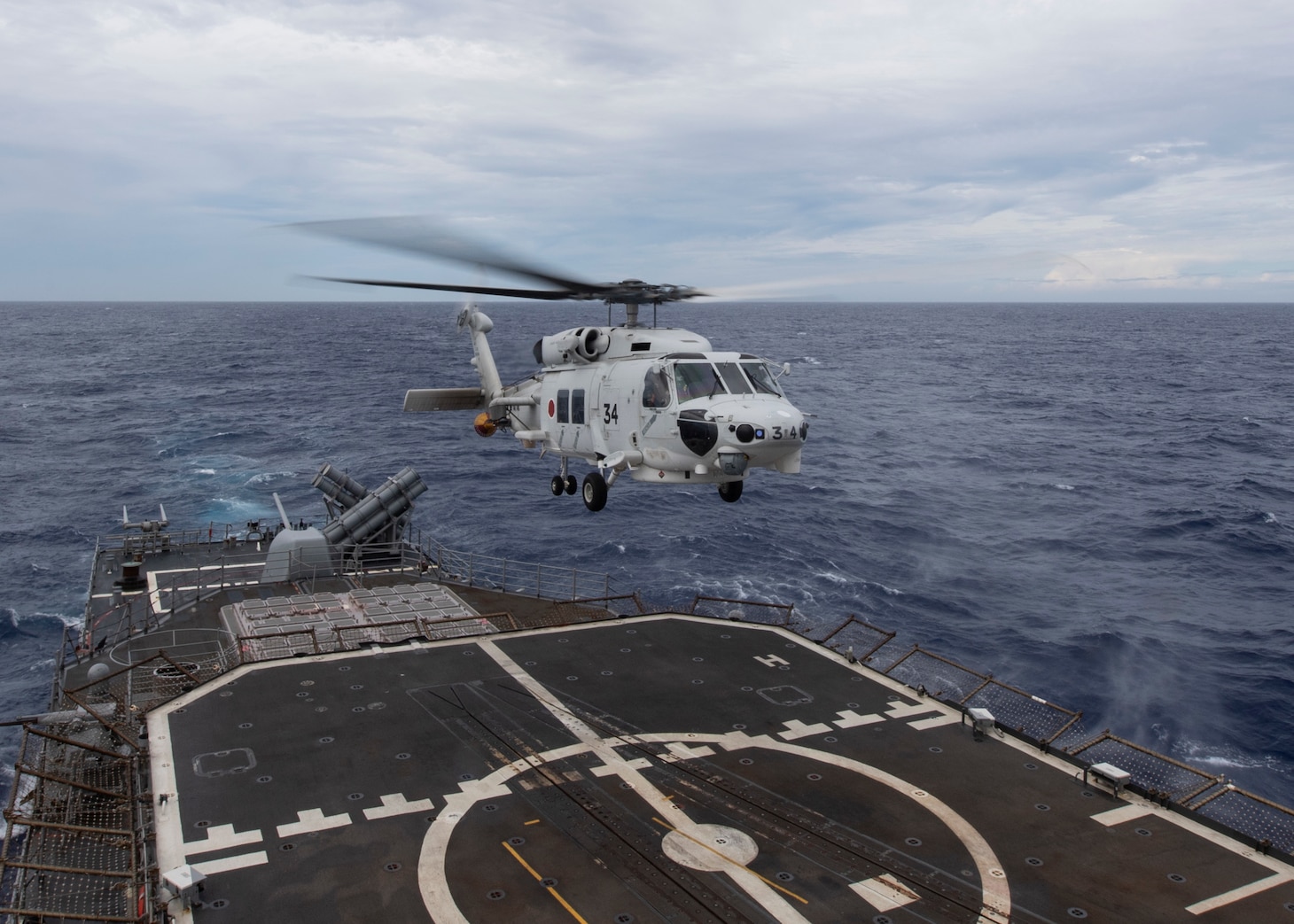 PHILIPPINE SEA (May 28, 2021) An MH-60K Sea Hawk, from the Japan Maritime Self-Defense Force (JMSDF) lands aboard the aboard the Ticonderoga class guided-missile cruiser USS Shiloh (CG-67). Shiloh is attached to Commander, Task Force 70/Carrier Strike Group 5 conducting underway operations in support of a free and open Indo-Pacific.
