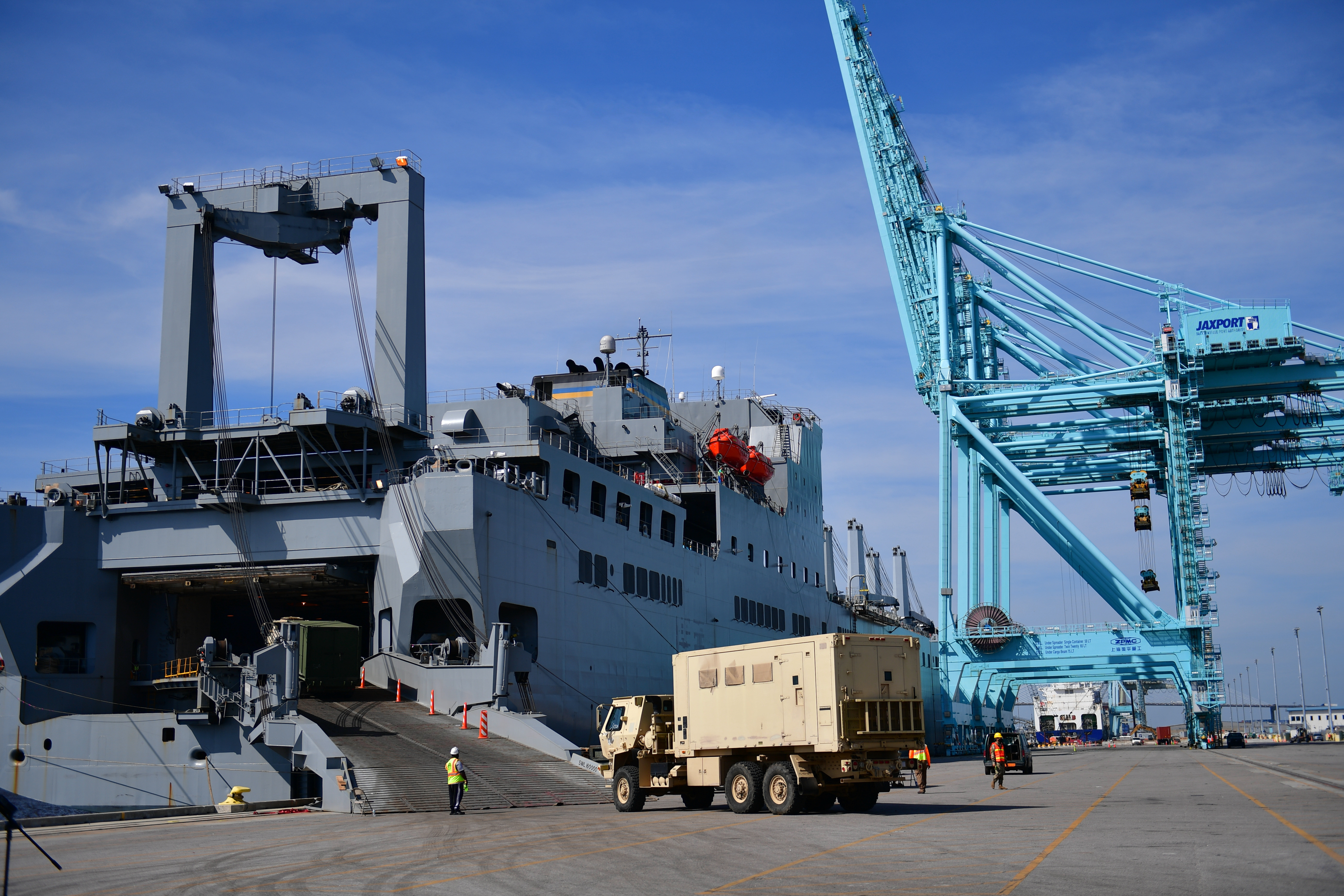 A stevedore at the Port of Jacksonville drives a military vehicle onto the U.S. Navy's Military Sealift Command's USNS Bob Hope March 26, 2021.