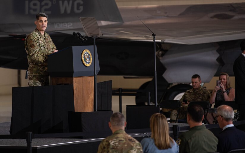 U.S. Air Force Col. Clint Ross speaks to joint service members prior to President Joe Biden's remarks.