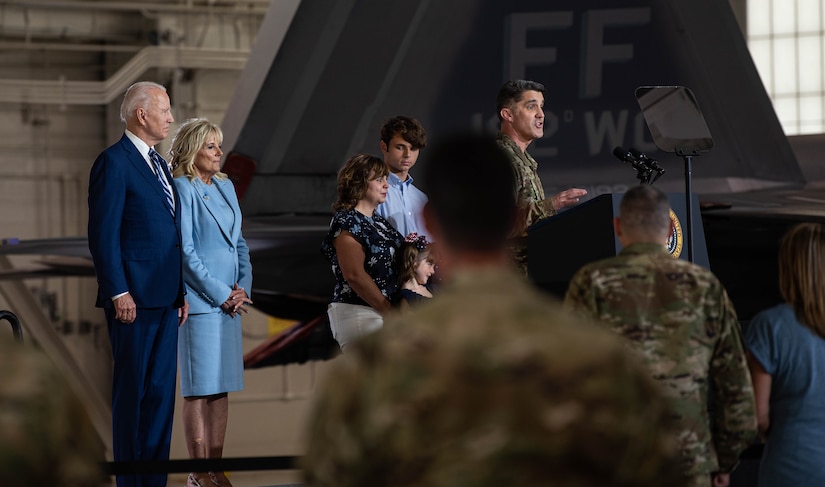 U.S. Air Force Col. Clint Ross speaks to joint service members prior to President Joe Biden's remarks.