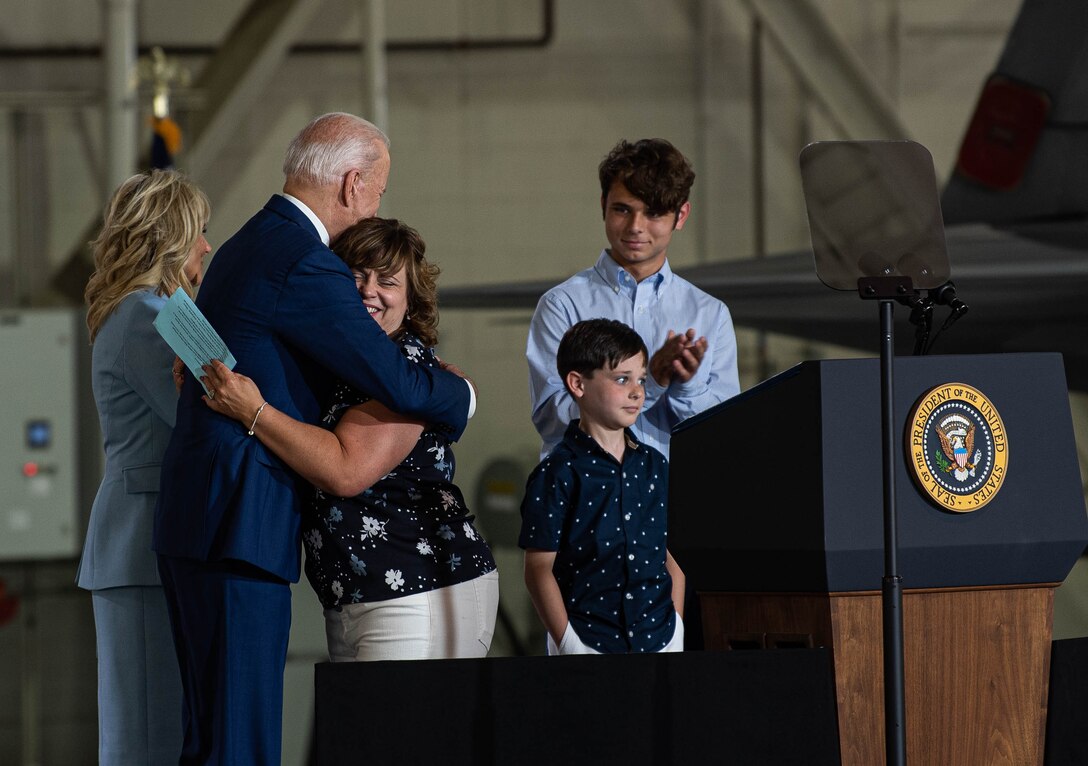 President Joe Biden embraces Brittany Bean, spouse of deployed U.S. Air Force Major Nathaniel Bean.