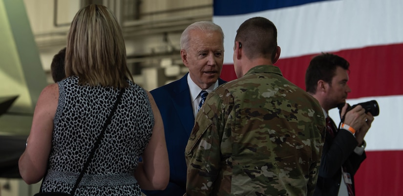 President Joe Biden interacts with service members