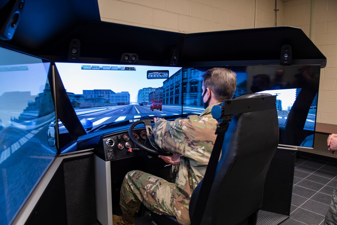 Maj. Gen. Miller uses the 4th LRS Driving Simulator