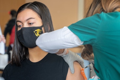 Asia Watson, 17, receives her COVID-19 vaccine at Patch Barracks, near Stuttgart, Germany, May 22, 2021.