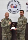 Sgt. 1st Class Rizmel Paguio, right, poses with Lt. Col. Marcus D. Perkins, commander of the U.S. Army Medical Materiel Center-Korea, after receiving a 2021 Uniformed Services Award from the Federal Asian Pacific American Council on May 26. (U.S. Army photo by Paek Hye-chin)