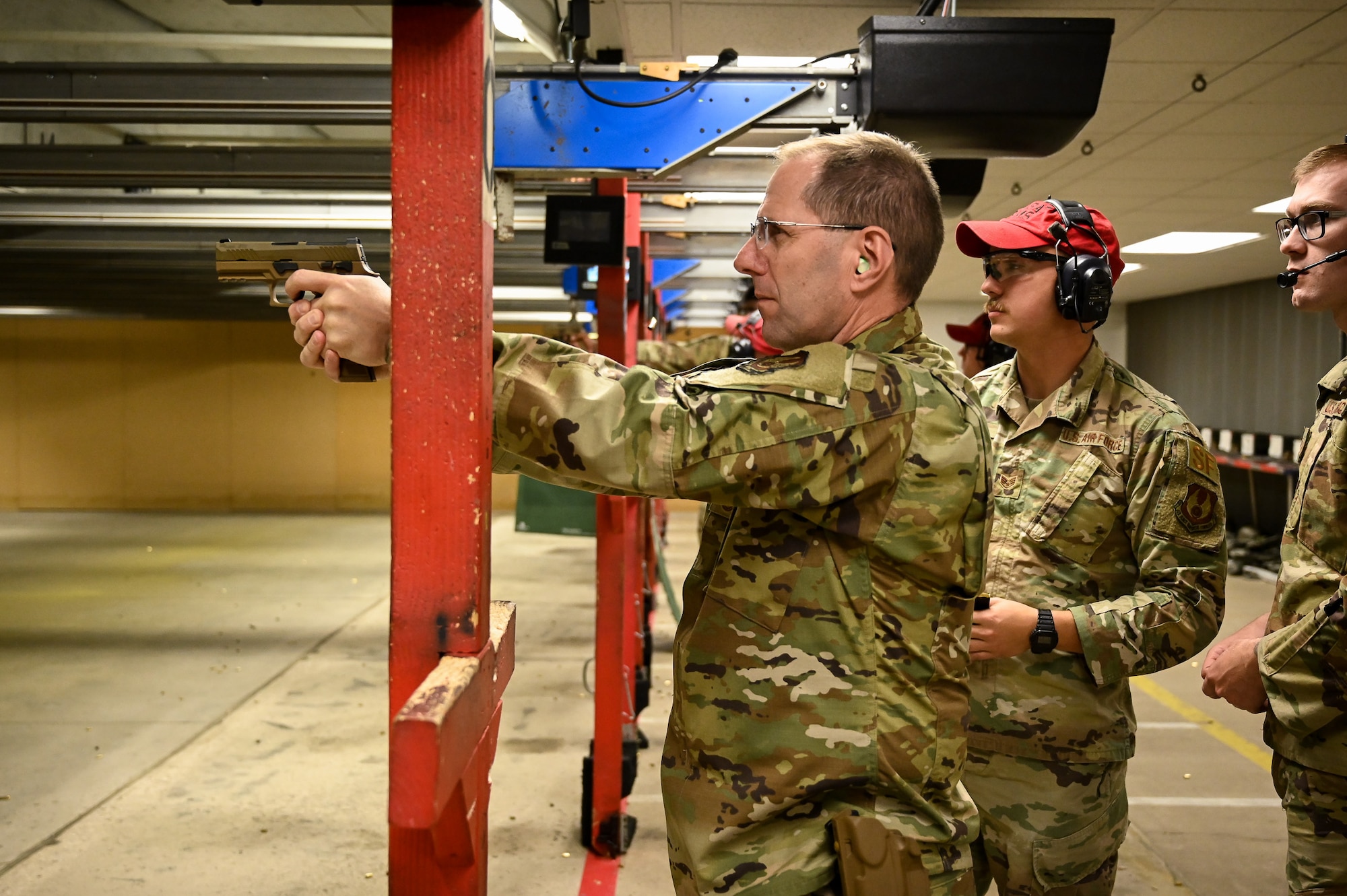 Chief Master Sgt. Stanley C. Cadell, command chief of Air Force Materiel Command, fires an M18 pistol during a visit to Hill Air Force Base, Utah, May 25, 2021. (U.S. Air Force photo by R. Nial Bradshaw)