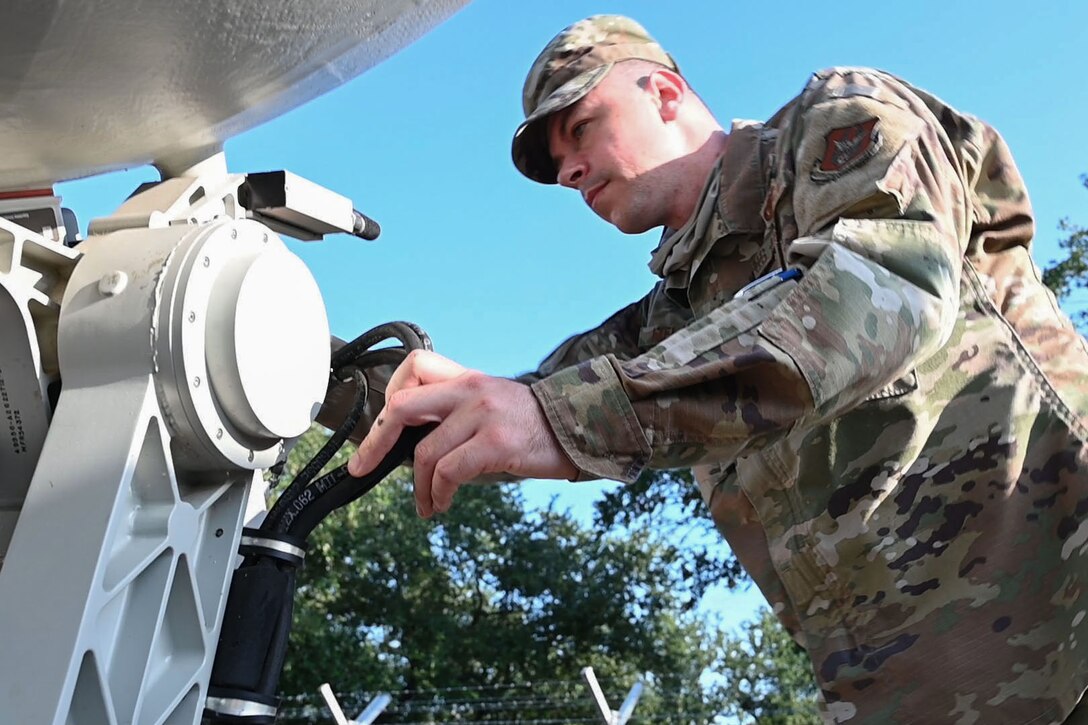 Photo of Airman working on equipment.