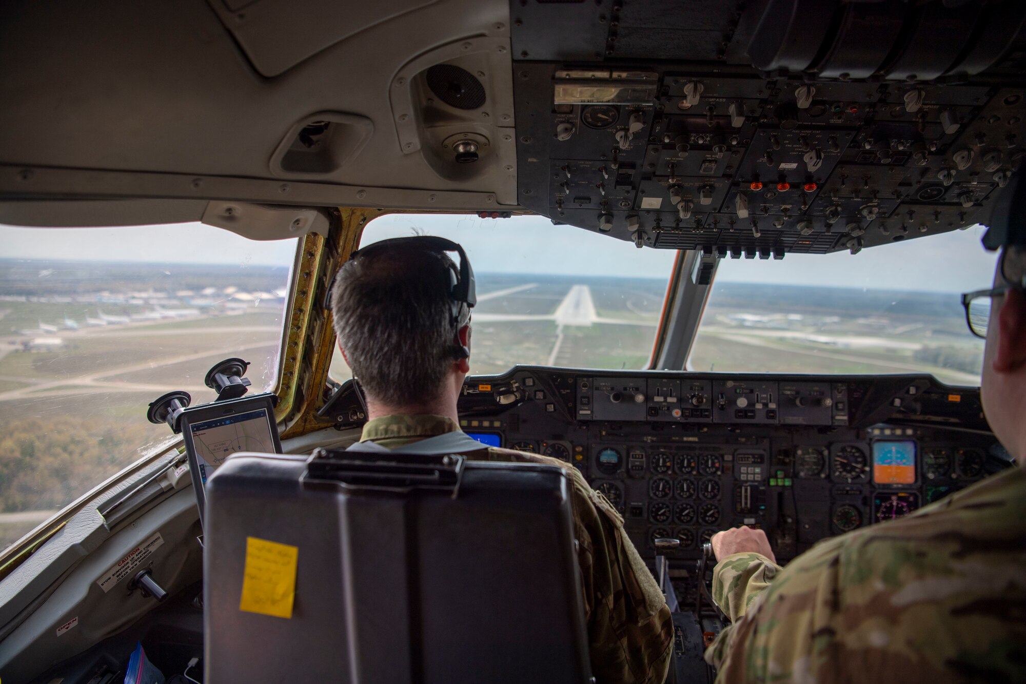 Photo of an Airman preparing to land a KC-10 Extender.