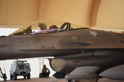 Col. Kristoffer Smith, 378th Expeditionary Operations Group commander, prepares for a flight aboard an F-16 Fighting Falcon fighter jet at Prince Sultan Air Base, Kingdom of Saudi Arabia, May 16, 2021. "Swamp Fox" Airmen from the South Carolina Air National Guard are deployed to PSAB to project combat power and bolster defensive capabilities against potential threats in the region.