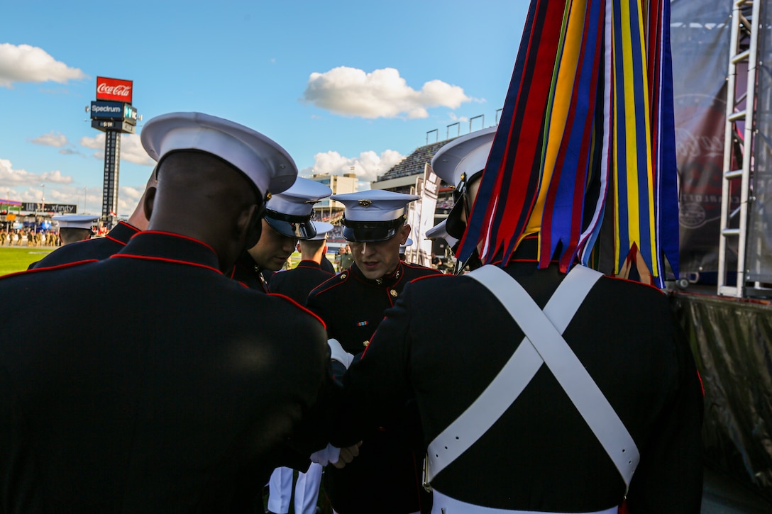 Marines with Marine Barracks Washington huddle up prior to their pre-race appearance at the Coca-Cola 600 at Charlotte Motor Speedway, Charlotte, North Carolina, May 30, 2021.