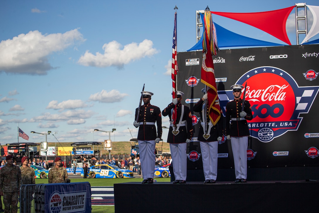 Marines with the Official U.S. Marine Corps Color Guard present the colors prior to the Coca-Cola 600 at Charlotte Motor Speedway, Charlotte, North Carolina, May 30, 2021.