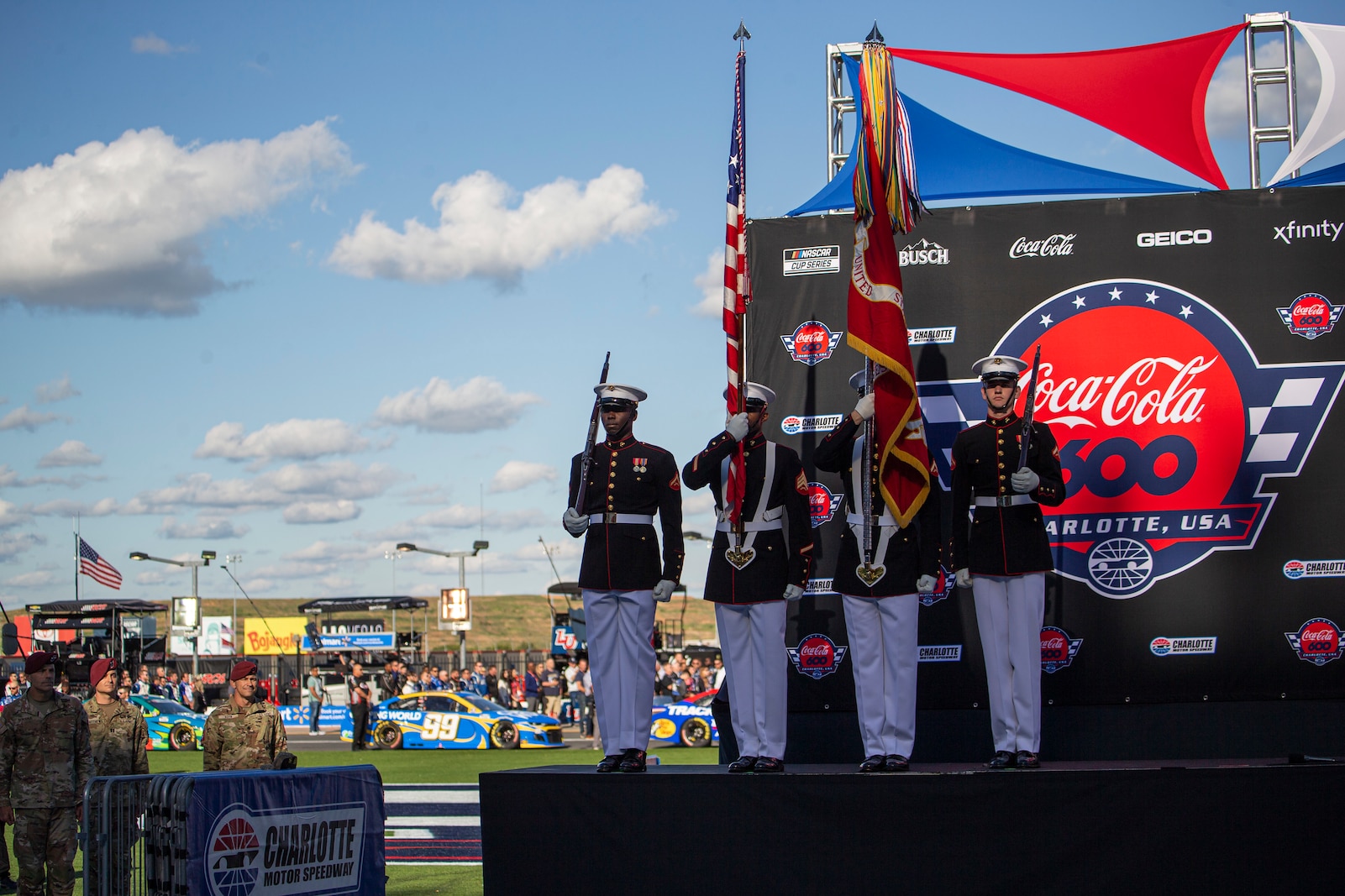 Marines with the Official U.S. Marine Corps Color Guard present the colors prior to the Coca-Cola 600 at Charlotte Motor Speedway, Charlotte, North Carolina, May 30, 2021.