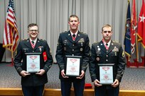 (From left to right) Staff Sgt. Scott Huish, Staff Sgt. Brad Carr, and Staff Sgt. Kedric Musselman show their steel de Fleury award after a ceremony at the Utah National Guard Headquarters May 22, 2021.