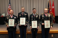 (From left to right) Lt. Col. Kevin Leitch, Capt. Nathan Griffin, Sgt. 1st Class Eric Dwelle, and Sgt. 1st Class Kevin Dimond show their bronze de Fleury award after a ceremony at the Utah National Guard Headquarters May 22, 2021.
