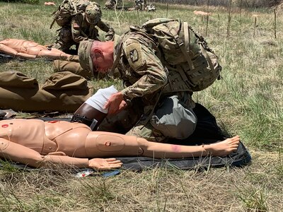 Soldier performs first-aid on dummy