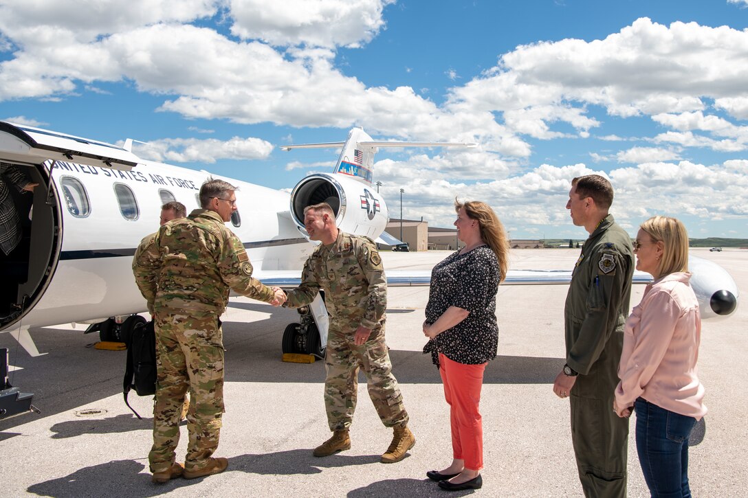 Gen. Tim Ray, Air Force Global Strike Command commander, is greeted by Col. David Doss, 28th Bomb Wing commander, upon his arrival at Ellsworth Air Force Base, S.D., May 25, 2021.