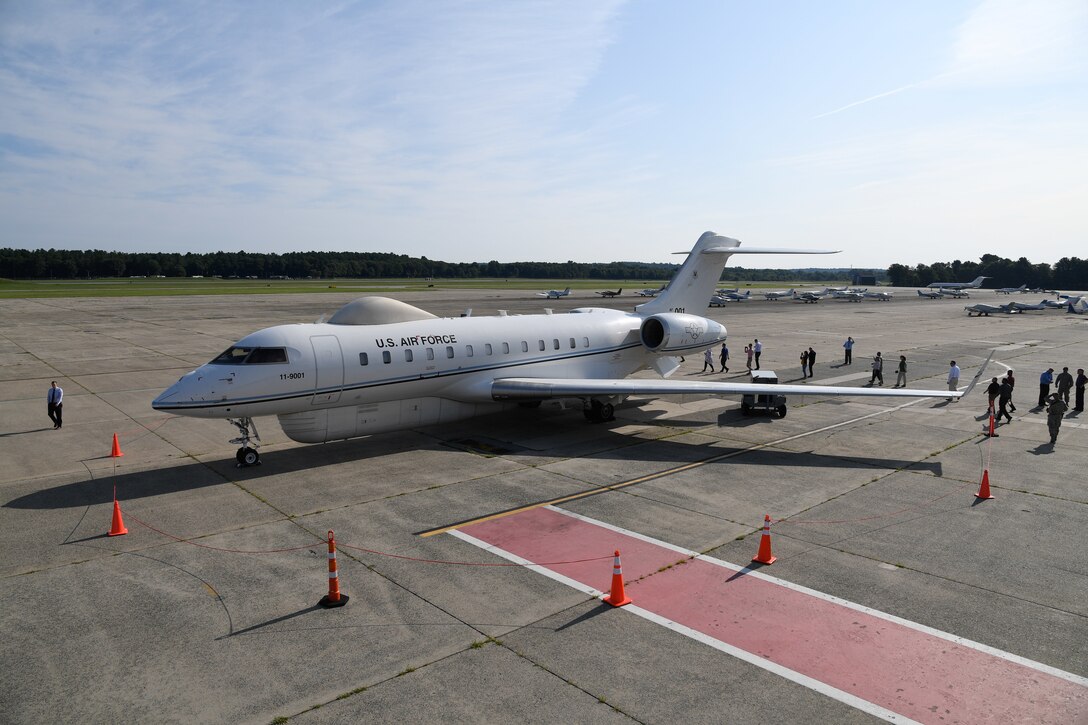 A Battlefield Airborne Communications Node-equipped E-11A aircraft rolls out on the flightline at Hanscom Air Force Base, Mass., in July 2018. On June 1, 2021, the BACN program office at Hanscom AFB awarded a $464.8 million contract to Learjet, Inc., a U.S. subsidiary of the Specialized Aircraft Division of Bombardier Inc., for up to six Bombardier Global 6000 aircraft with a five-year delivery period.