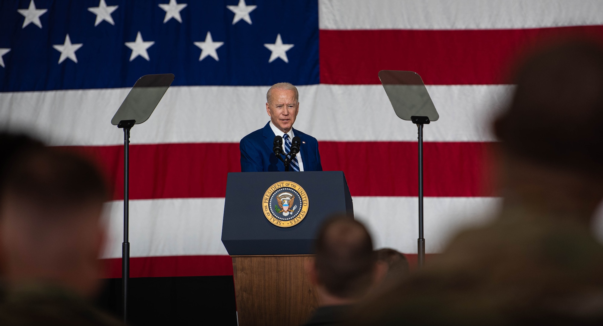 President Joe Biden and first lady Jill Biden interact with service members.