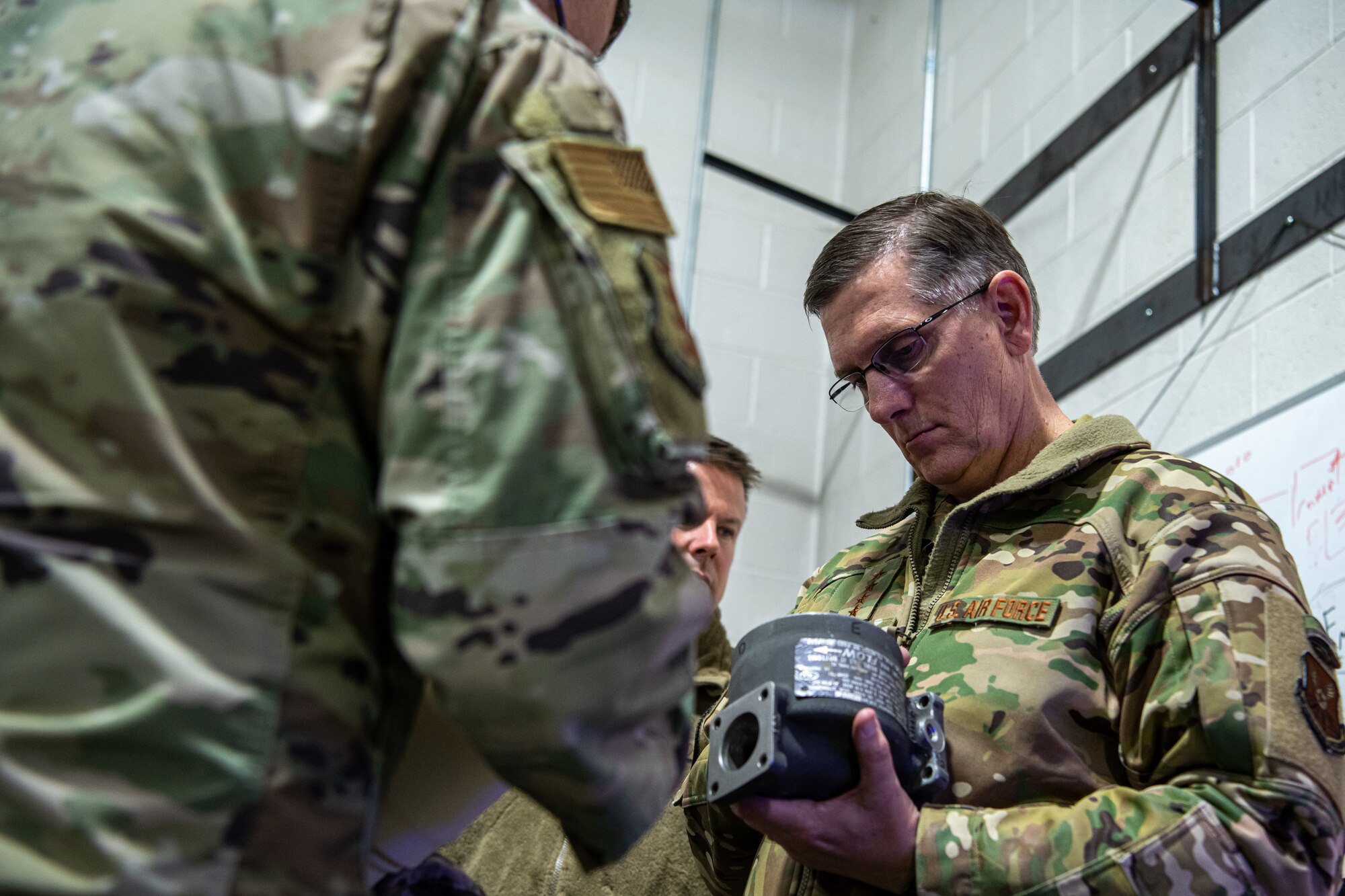 Gen. Tim Ray, Air Force Global Strike Command commander, receives information on equipment being used to maintain the B-1B Lancer fleet on Ellsworth Air Force Base, S.D., during a tour on May 26, 2021.