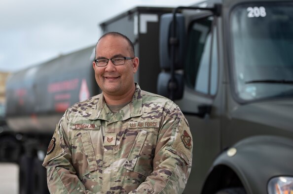 U.S. Air Force Tech. Sgt. Jason Ornellas, noncommissioned officer in charge of the Fuels Environmental and Safety office assigned to the 36th Logistics Readiness Squadron stands in front of one of his fuel trucks at Andersen Air Force Base, Guam, May 27, 2021. The 36th LRS provides Andersen AFB with the full spectrum of logistics support to include operating the largest fuel storage location in the Air Force and overseeing the installation deployment and reception operations. (U.S. Air Force photo by Senior Airman Helena Owens)
