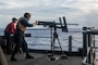 A Sailor fires a .50-caliber machine gun during a "Killer Tomato" live-fire exercise on the fantail of the U.S. Navy's only forward-deployed aircraft carrier USS Ronald Reagan (CVN 76).